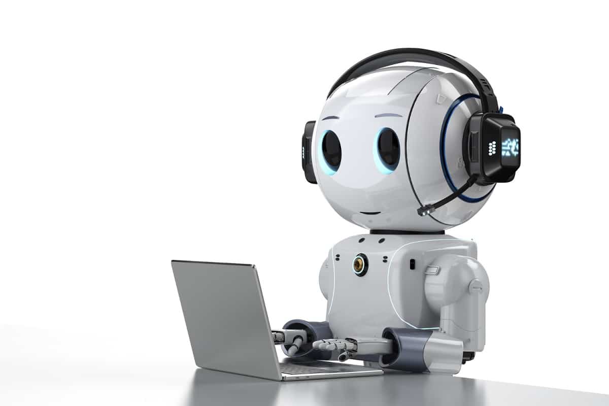 Robot chatbot working on laptop representing AI chat assistant